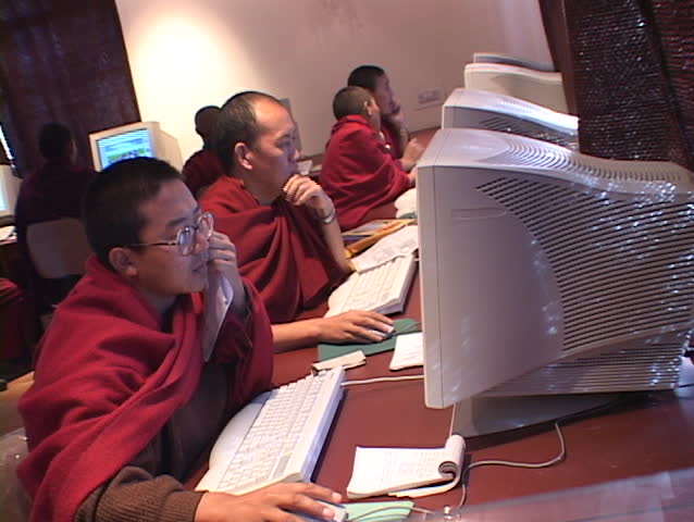 DHARAMSALA, INDIA - CIRCA 2001: A group of Buddhist monks work on computers circa 2001 in Dharamsala, India.