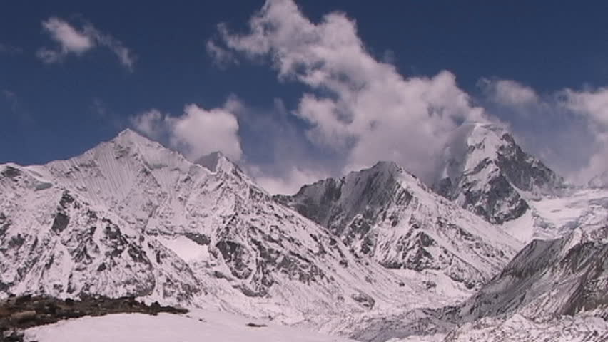 Shot from Mt. Everest in Tibet, clouds blanketing Mt. Pumori in Nepal 