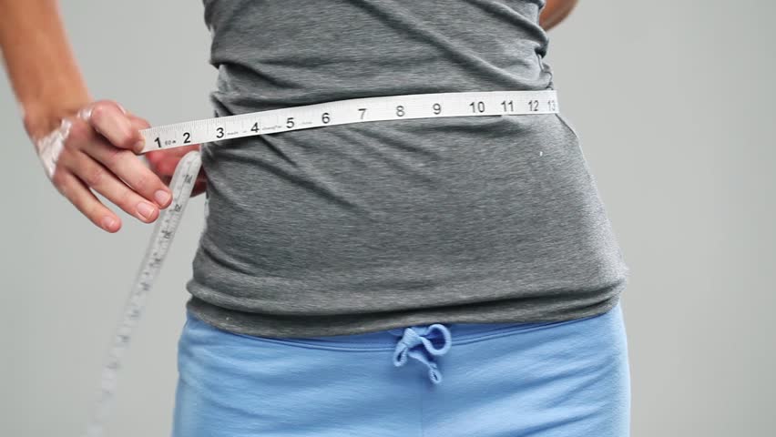 Woman measuring her Perfect sexy waist