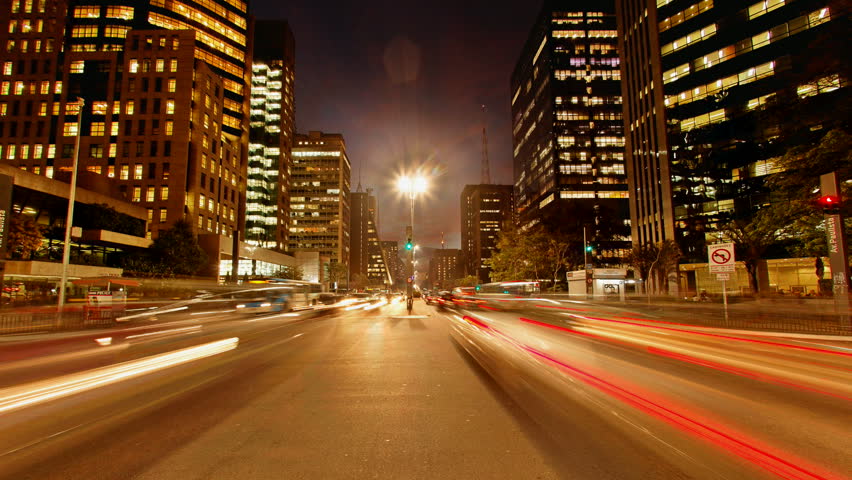 SAO PAULO, BARAZIL - JUNE 29: (Timelapse View) Cars race home at rush hour after work on Avenida Paulista, June 29, 2011 in Sao Paulo, Brazil. 