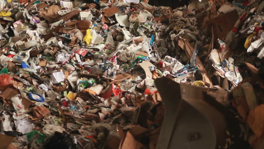 EASTERN U.S. - CIRCA 2008: A bulldozer hauls garbage