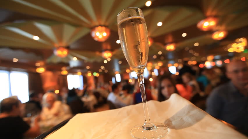 Waiter and a glass of champagne on a tray