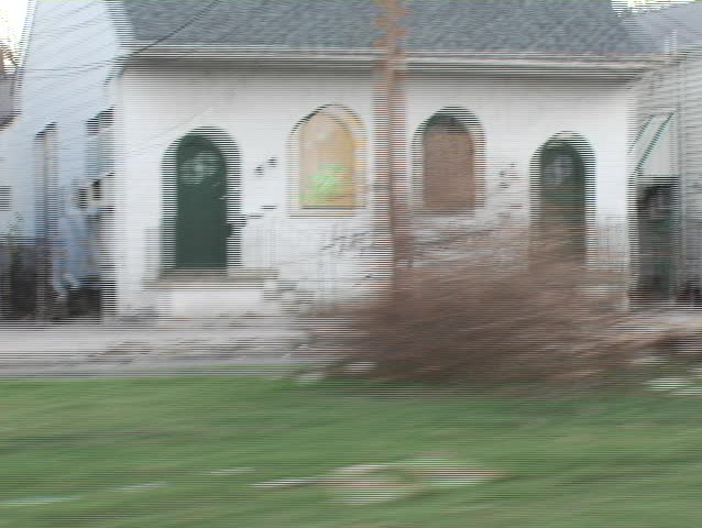 "Help! Help!" painted on the side of an abandoned building filmed weeks after Katrina had swept through the area.