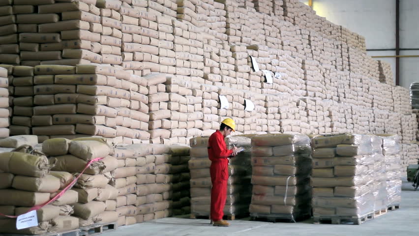 Worker checking sucks of sugar in a large warehouse. HD 1080i. 