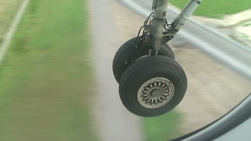 Landing: the airplane goes to airfield,  undercarriage close-up   (HD video,  23 sec)
