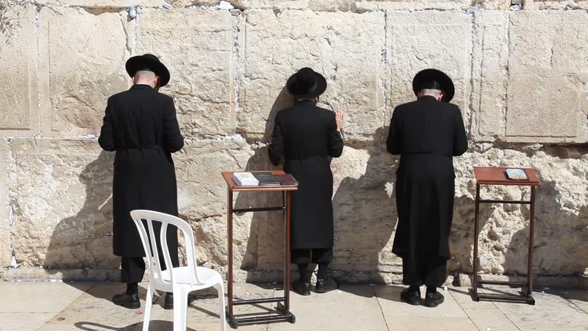 JERUSALEM, ISRAEL - CIRCA OCT 2011: Orthodox Jews pray at the Western Wall circa October 2011 in Jerusalem.