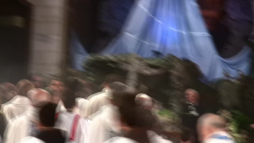 NAZARETH, ISRAEL - DEC 24, 2008: The priest walks out during final procession at the Basilica of Annunciation on December 24, 2008 in Nazareth.