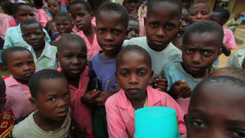 KENYA, AFRICA - CIRCA 2011: Children swarm around the camera.