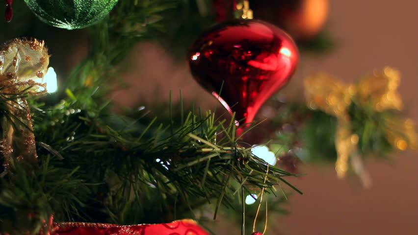 Dolly of ornaments on a Christmas tree.