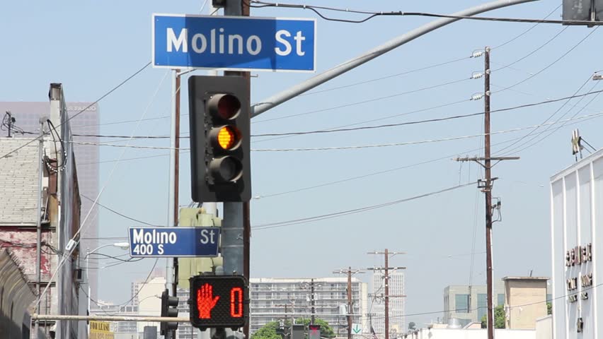 Yellow stop light and crosswalk light on downtown street, red, green, yellow, red