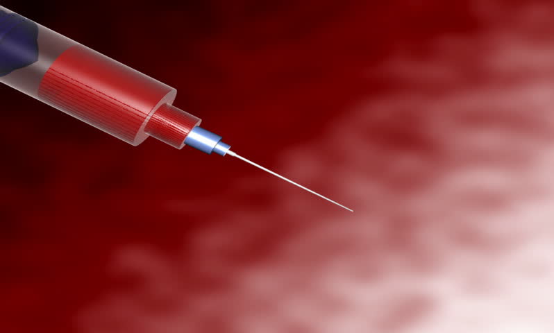 Footage of a  syringe dropping blood drops