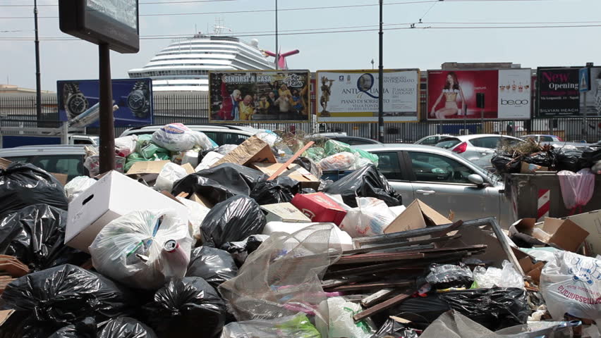 NAPLES, ITALY CIRCA JUNE 2011: Piles of garbage and trash along road during protest marches and demonstrations against government and high unemployment in Naples. Euro economic problems plague Europe.