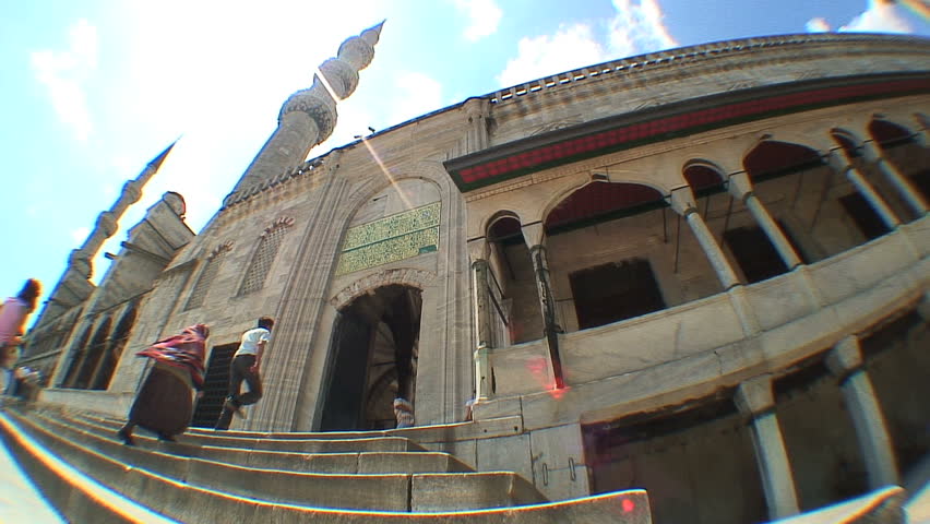 ISTANBUL, TURKEY - JULY 14, 2006: Worshippers enter the Blue Mosque 