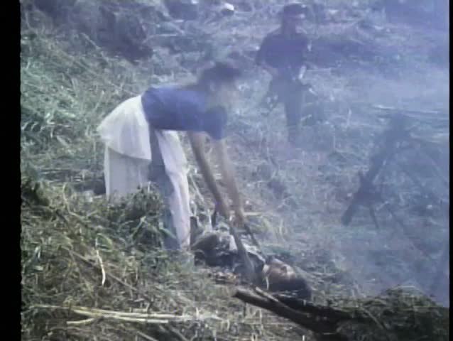 Woman trying to revive a dead soldier