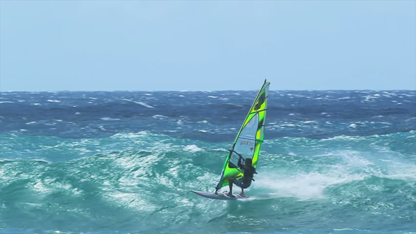 MAUI, HI - MARCH 13: Professional windsurfer Dean Christiner rides a large wave. March 13, 2011 in Maui, HI.