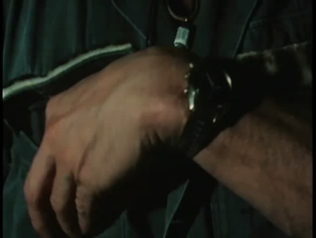 Close-up hand removing vial from pocket