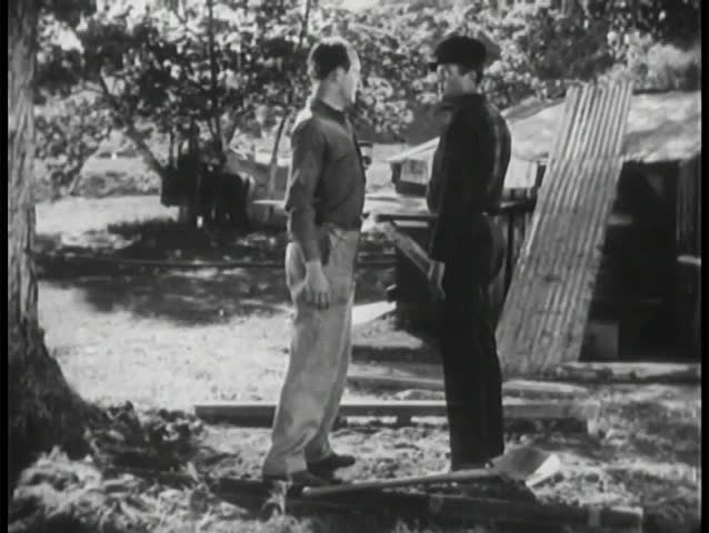 Man punches another man to the ground