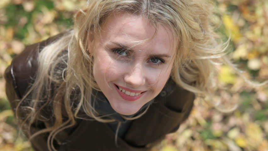 Overview of a smiling young woman looking at camera