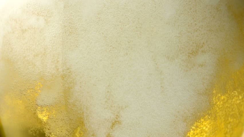 Extreme close-up beer bubbles in a glass