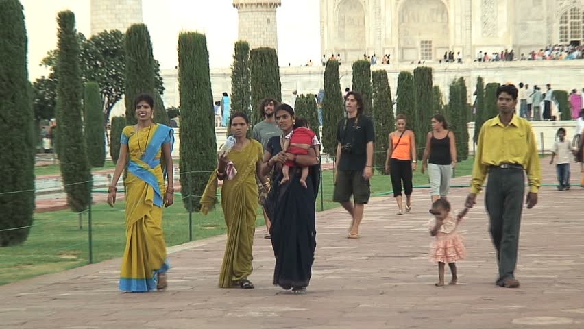 AGRA, INDIA - AUGUST 16, 2006: Hindus and tourists at the Taj Mahal in Agra, India
