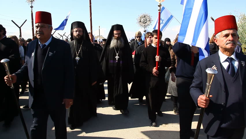 QASR AL YAHUD, ISRAEL - JANUARY 18: Greek Orthodox Patriarch's procession with priests and pilgrims at march in Qasr Al Yahud Baptismal Site, Israel on January 18, 2012.