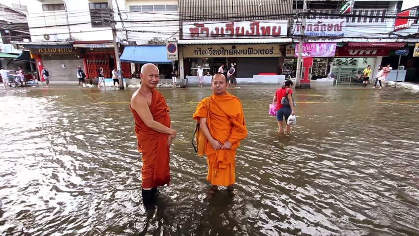 BANGKOK - 30 OCTOBER 2011: Two Buddhist monks in flood