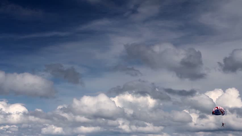 Parasailing, flying with parachute
