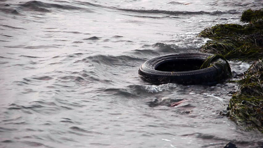 Old tyre in dirty polluted sea - Hazardous - Environment - Pollution - Full HD