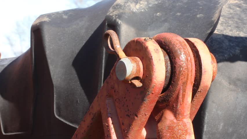 Rubber Mallet Driving Rusty Link Pin In Place