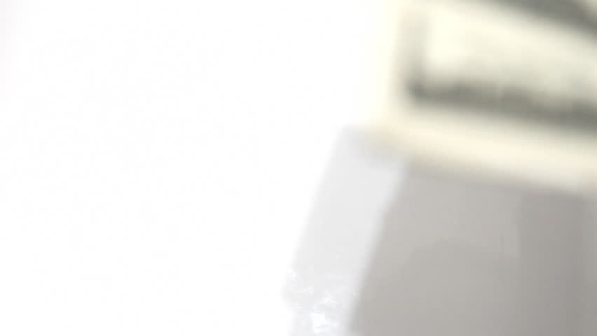 falling dollars on white background