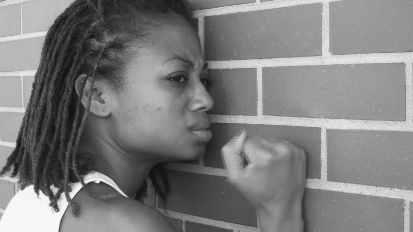 An angry/sad girl shows her frustration. Black and white.