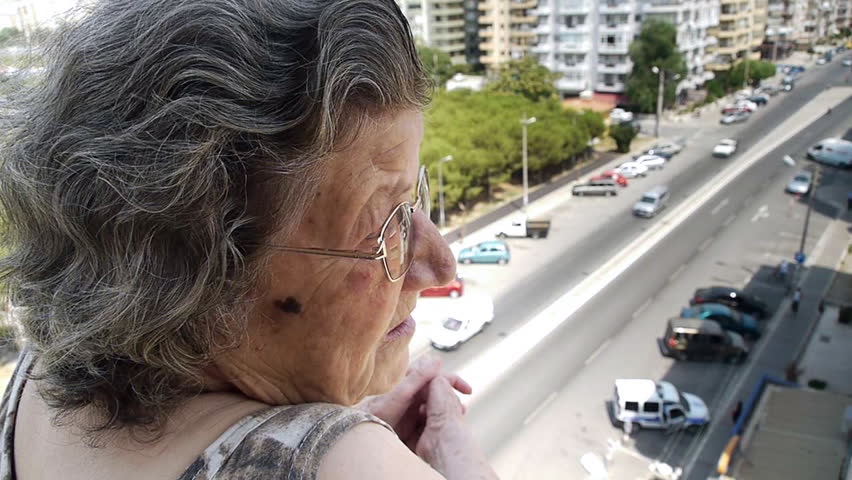 Old retired woman watching traffic from balcony - Retirement Home - Transportation - Full HD