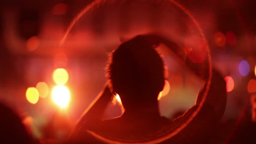 Footage of a crowd partying at a rock concert