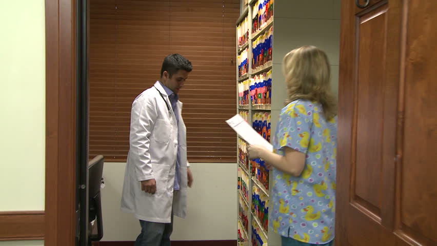 Doctor and nurse in filing room