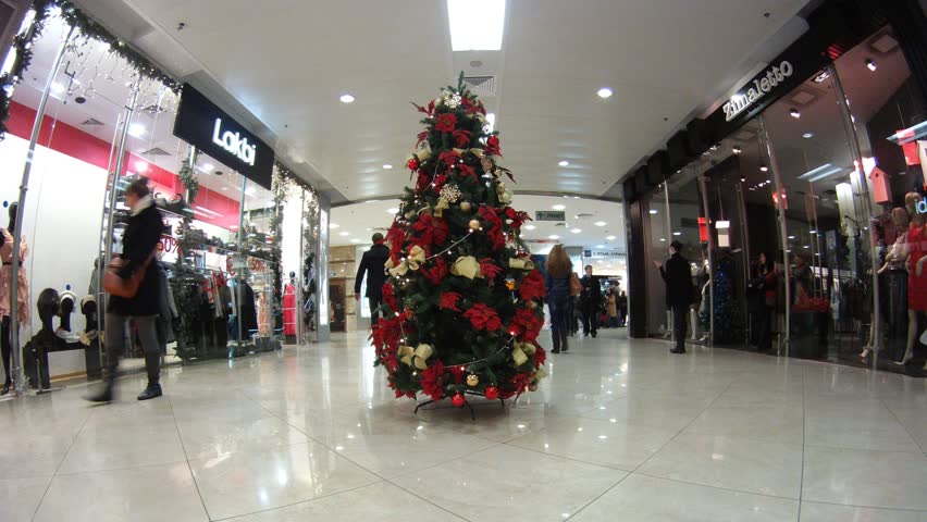 MOSCOW - DEC 21: (Time lapse View) New Year tree stands in hall in shopping center European, on Dec 21, 2011 in Moscow, Russia. People do last minute shopping for the Christmas season.