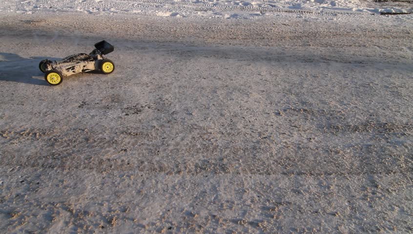 RC buggy car spinning on snow