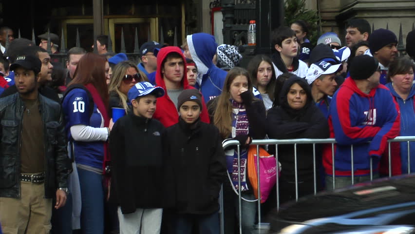 NEW YORK - FEBRUARY 7: Fans watch ticker-tape parade in honor of the Super Bowl Champions New York Giants on February 7, 2011 in New York. 