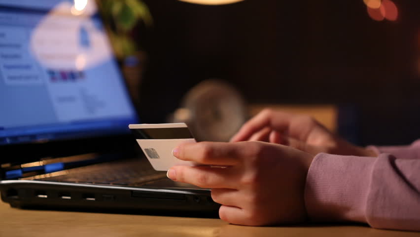 HD dolly: a girl using credit card on-line 