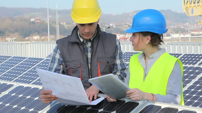 Man showing solar panels technology to student girl