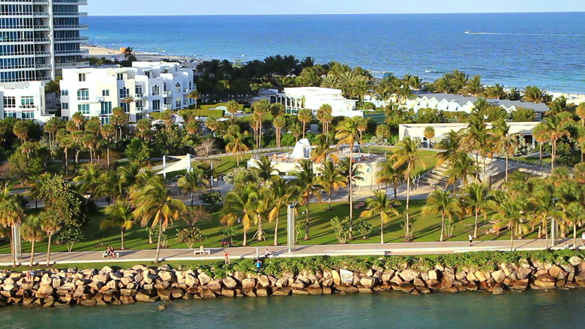 Miami shoreline shot from aerial view, tropical palmtrees and climate.