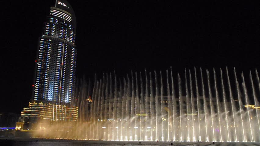 DUBAI - FEBRUARY 4: Fountain near Burj Khalifa illuminated by the city at night on February 4, 2012 in Dubai, United Arab Emirates.