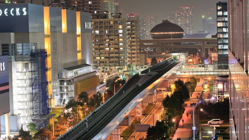TOKYO - FEBRUARY 23: (Time lapse view) The New Transit Yurikamome driverless train at Daiba on February 23, 2012 in Tokyo, Japan.