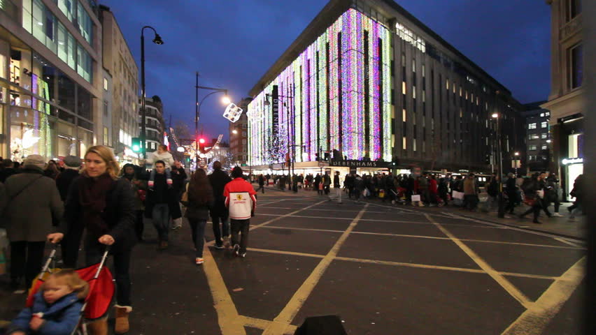 LONDON, UK - DECEMBER 27: Busses and other traffic drive beneath Christmas lights on Oxford Street on December 27, 2011 in London, UK. Oxford Street is one of the main shopping streets of London.