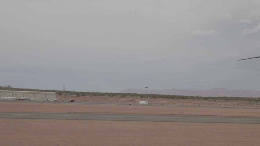 Aircraft V-22 Osprey VTOL hover mode taxi on runway close during strong sand storm video in Utah. Combat aircraft used by Marines, USAF, Navy and allies worldwide.