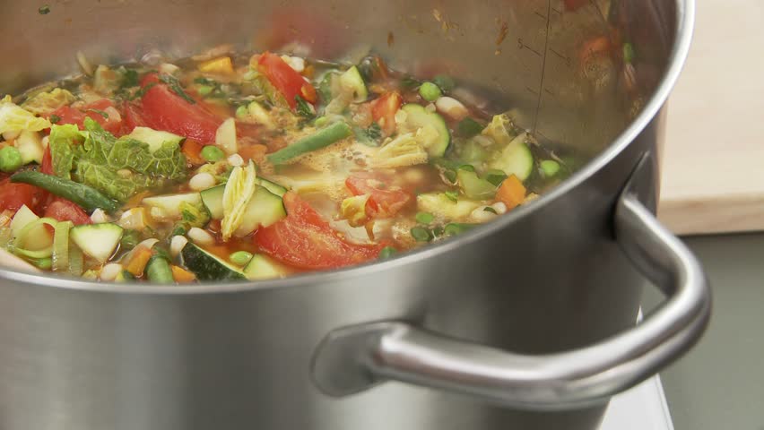 Vegetable stew being quenched with stock