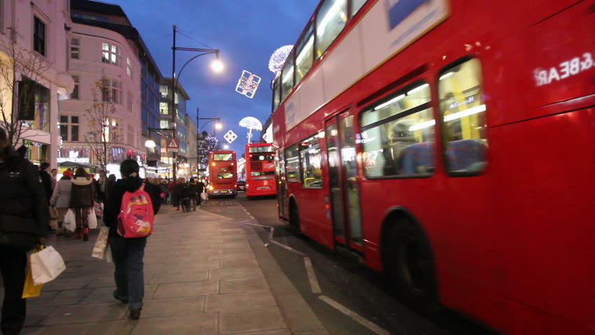 LONDON, UK - DECEMBER 27: Busses and other traffic drive beneath Christmas lights on Oxford Street on December 27, 2011 in London, UK. Oxford Street is one of the main shopping streets of London.