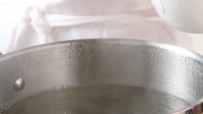 Pasta being placed in boiling water
