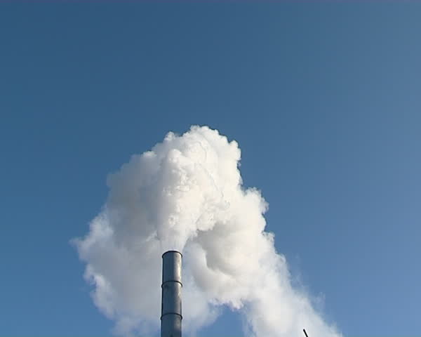 white smokes from boiler house chimney on background of blue sky. environmental air pollution.
