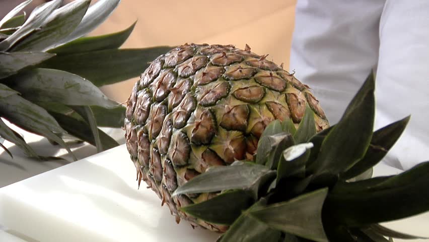 Peeling a pineapple