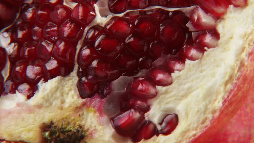 Pomegranates, whole and cut open